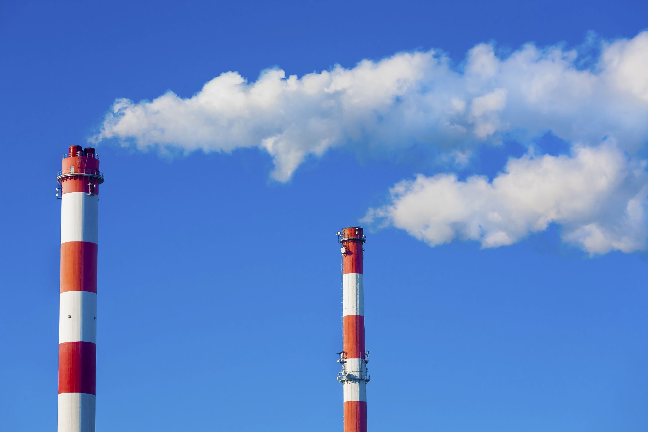 Chimneys with dramatic clouds of smoke 478426045 ThinkstockPhotos